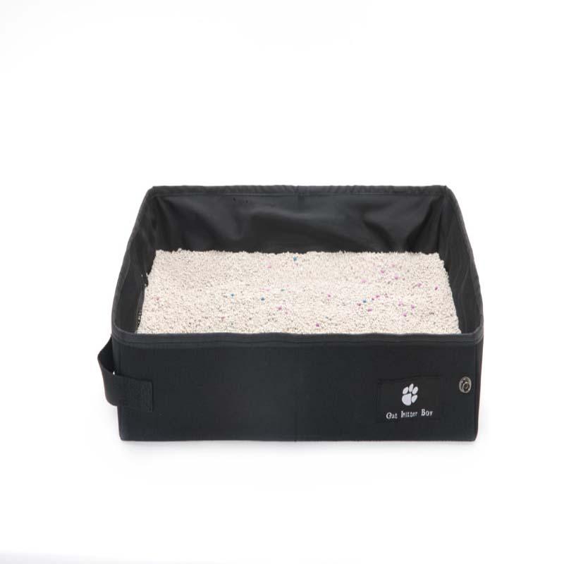 Black pet litter box with white litter on a white background
