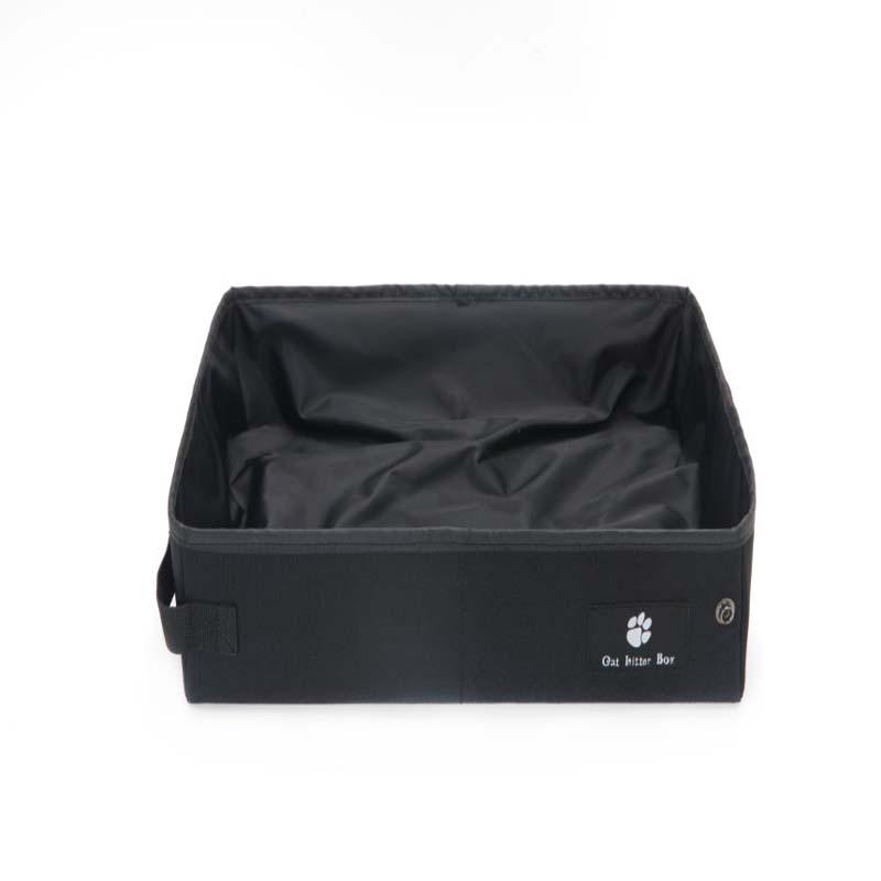 Black ptravel litter box with a paw print logo on a white background