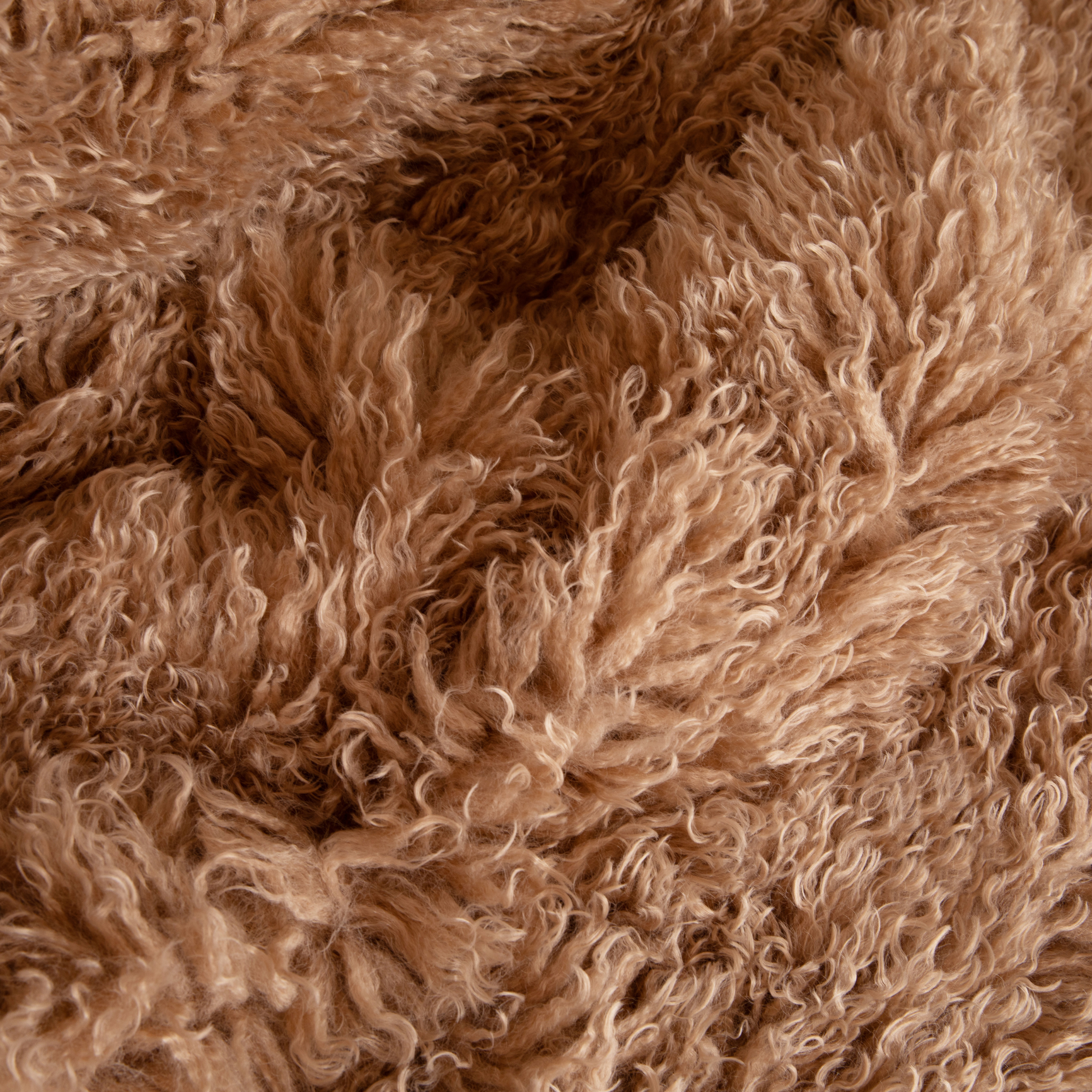 Close-up of brown fluffy fabric texture