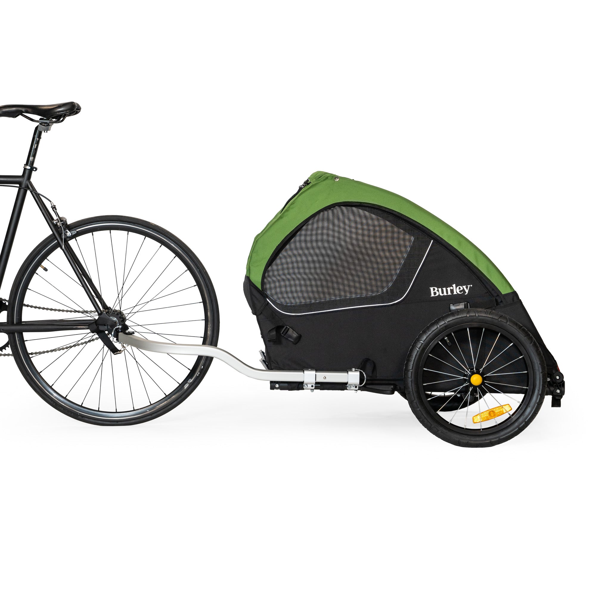 Bicycle with a green and black Burley bike trailer on a white background