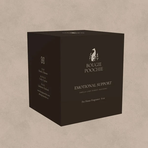 A dark brown rectangular box for Bougie Poochie Emotional Support home fragrance, shown at a three-quarter angle against a textured beige background.