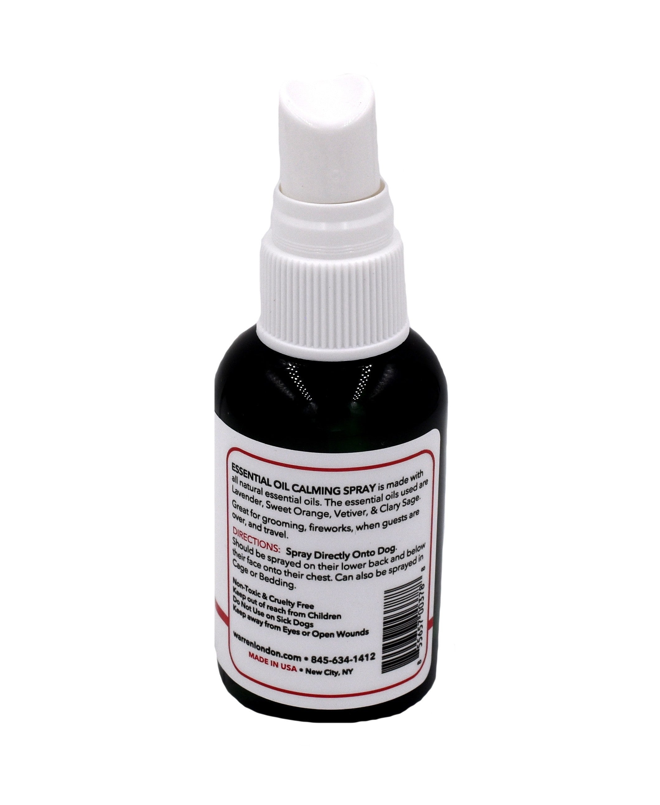 Bottle of essential oil calming spray with a white label on a white background