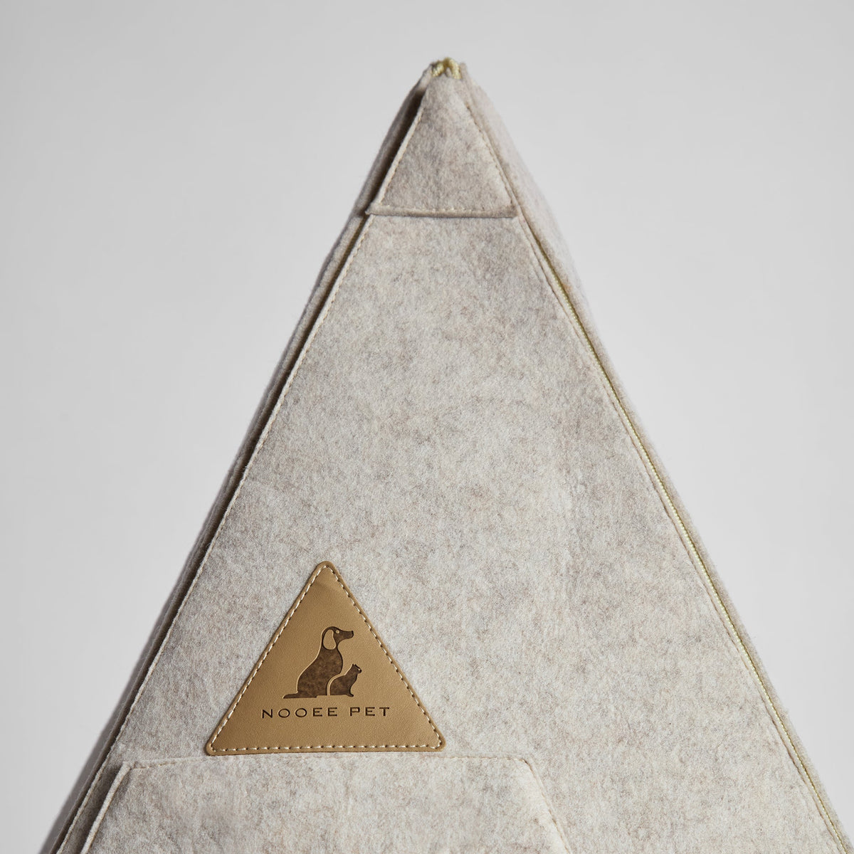 Back of the Nooee teepee pet bed with leather Nooee Pet logo