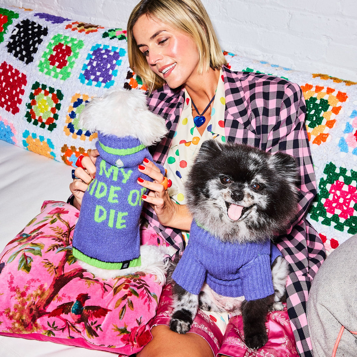Woman and her dog both wearing Purple Green Ride or Die sweaters
