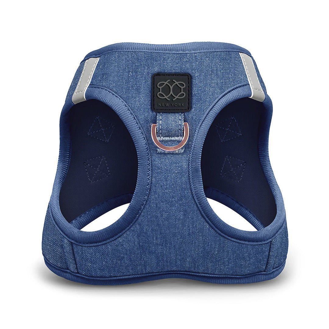 Blue dog harness with a brand logo on a white background