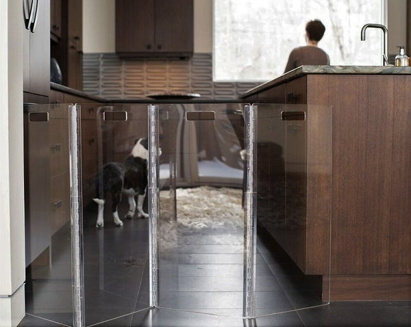 Acrylic clear dog gate in a modern home by Hiddin dog brand. 