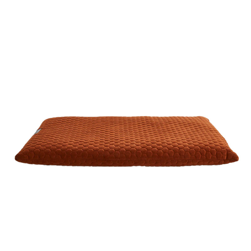 Brown textured dog cushion on a white background