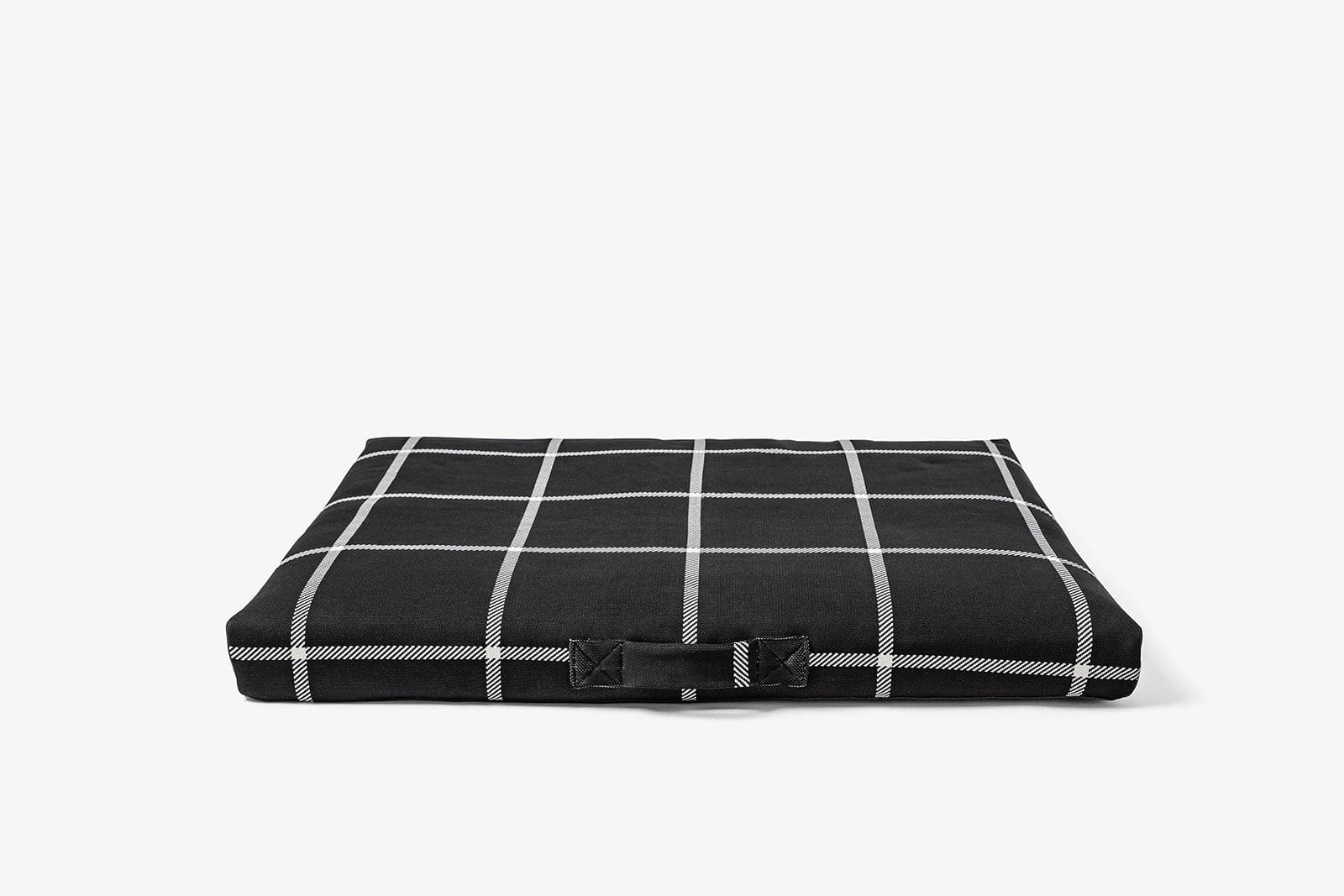 Black and white checkered Lay lo dog bed on a white background