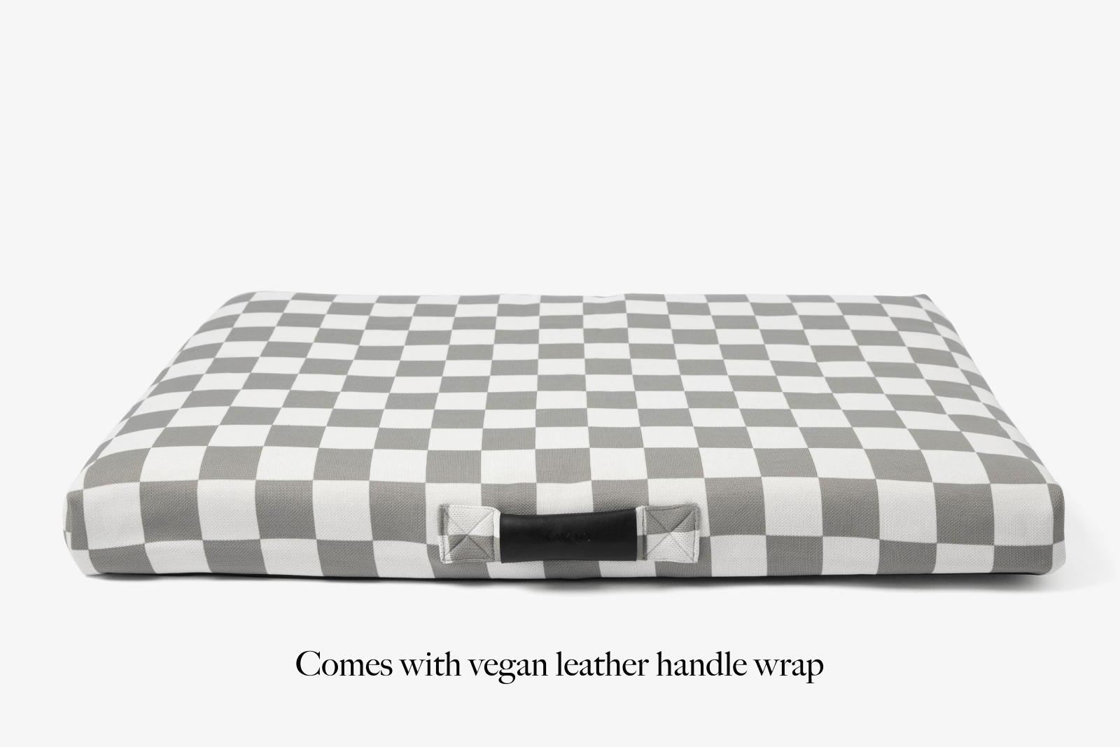 Designer checkered dog bed with vegan leather handle wrap on a white background. Lay lo pet beds.