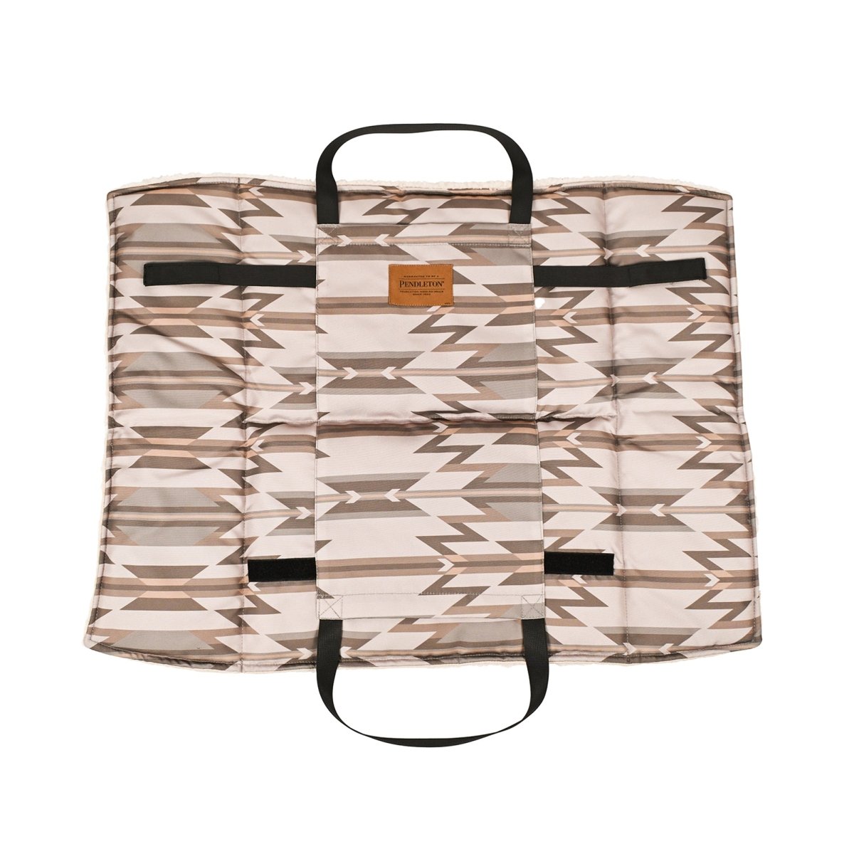 Patterned Pendleton dog travel bed with black straps on a white background