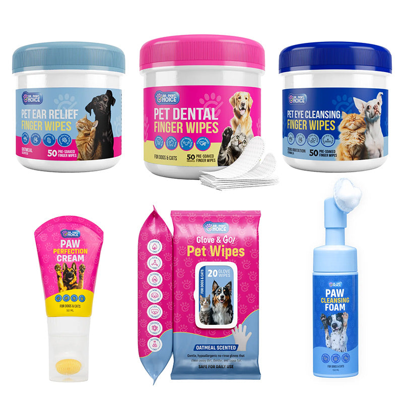 Collection of pet care essentials including finger wipes, cream, ear wipes, and paw cleaning foam on a white background.
