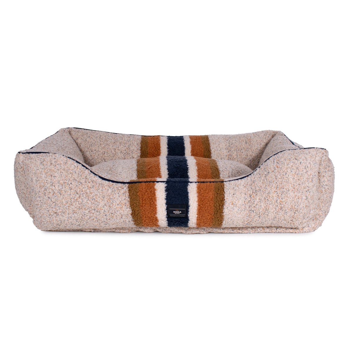 Berber cover beige dog bed with striped pattern on a white background
