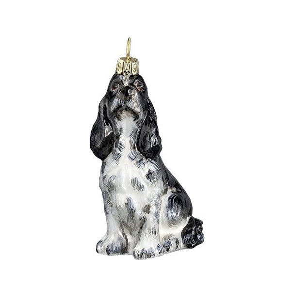 A handcrafted glass Springer Spaniel dog Christmas ornament, with black, white, and brown coloring, sitting upright with a festive collar.