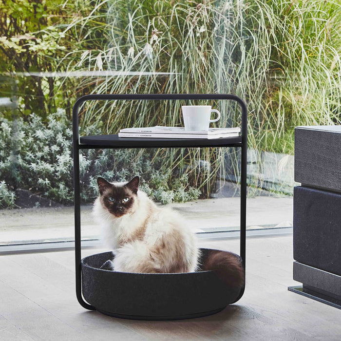 Siamese cat sitting in modern cat bed Miacara side table pet furniture