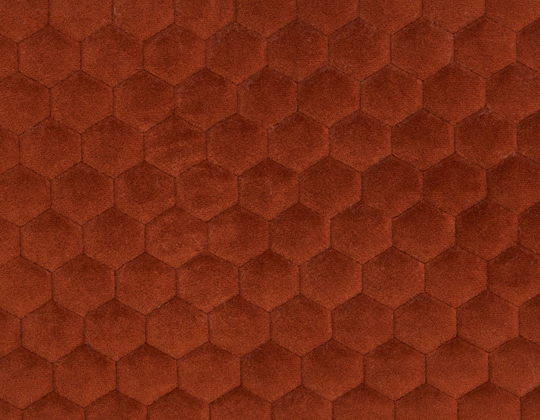 Hexagonal patterned fabric in a rust color