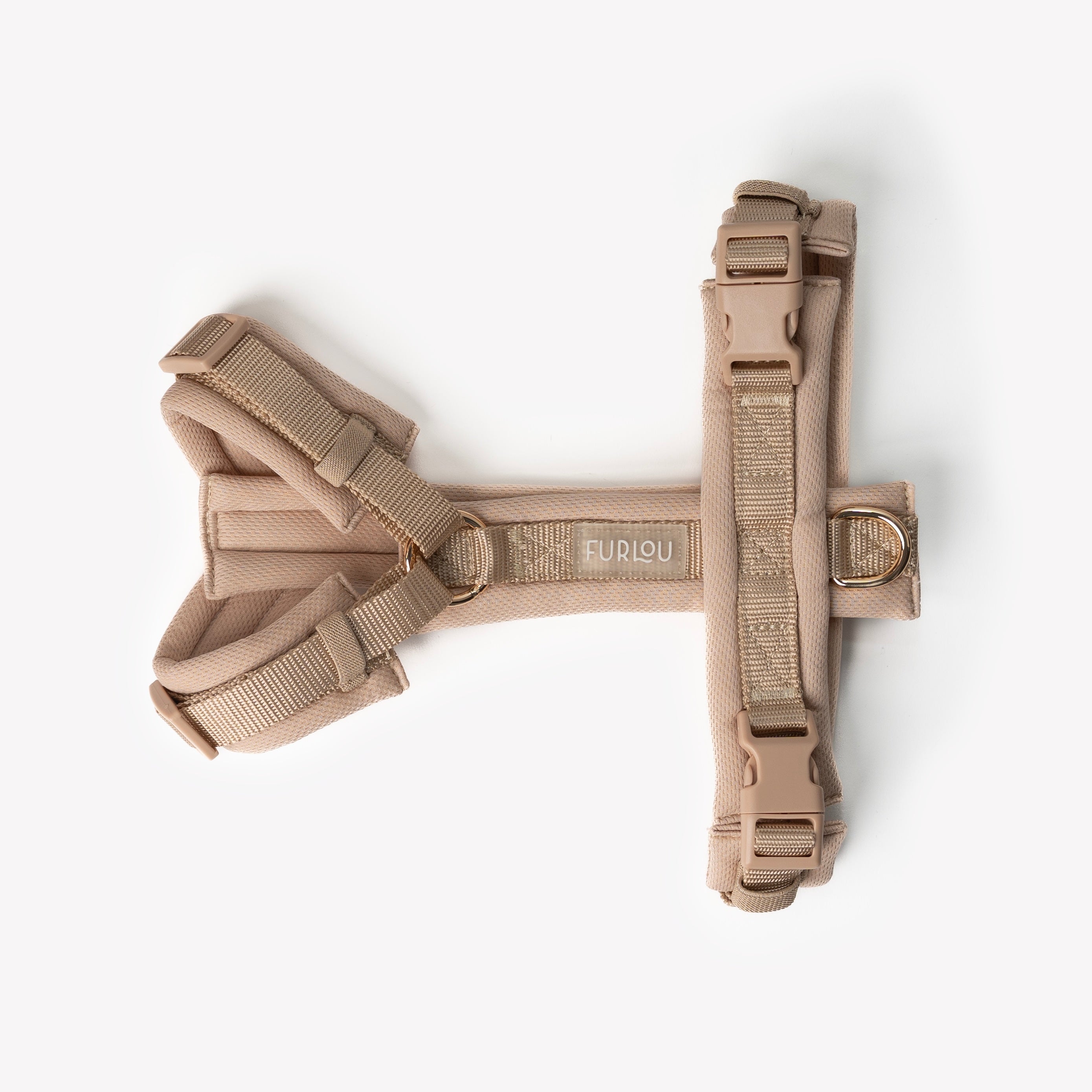 Tan dog harness on a white background