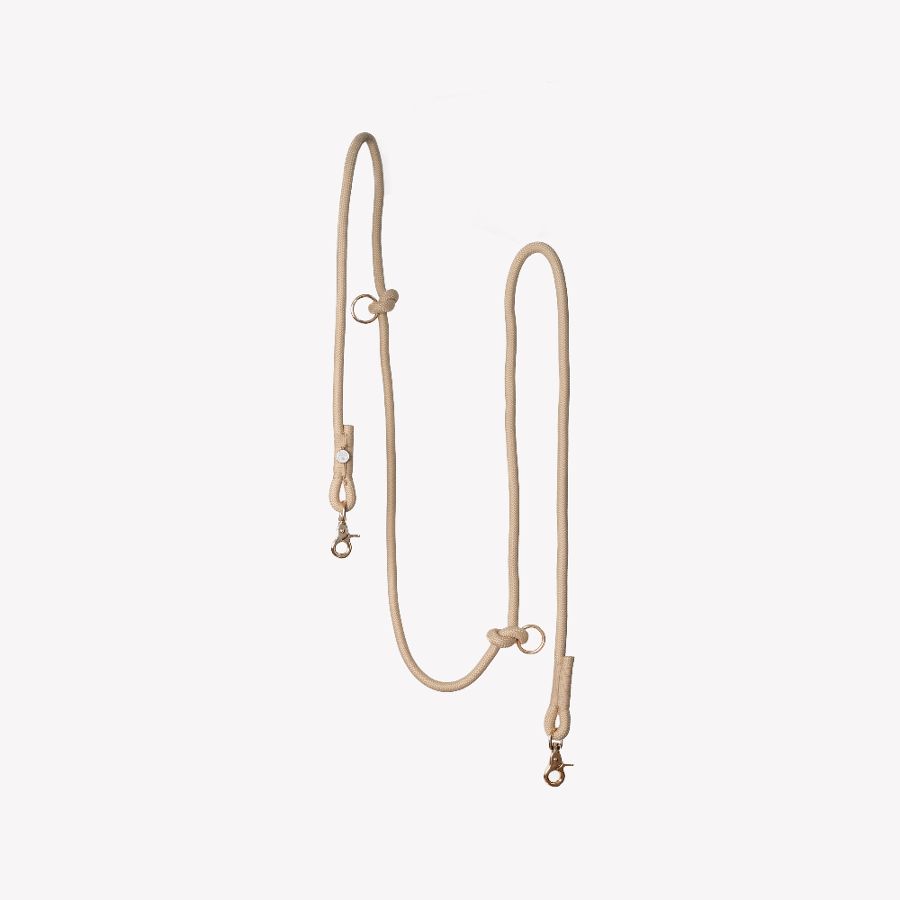 Beige dog leash on a white background