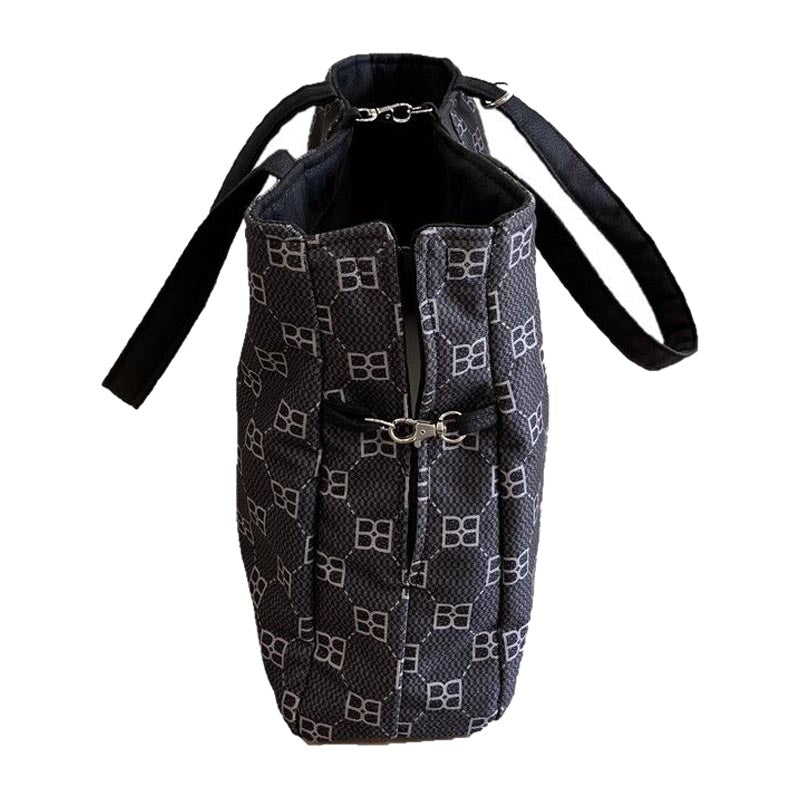 Fashionable dog carrier from bowsers with adjustable opening