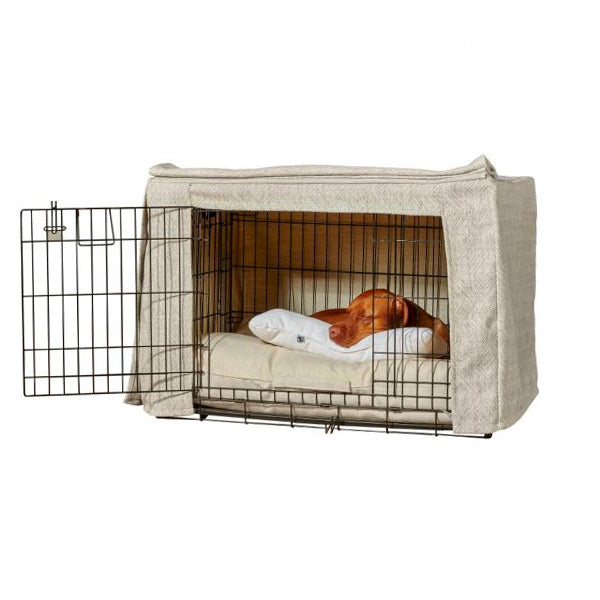 Large dog sleeping in two door dog crate with stylish covers