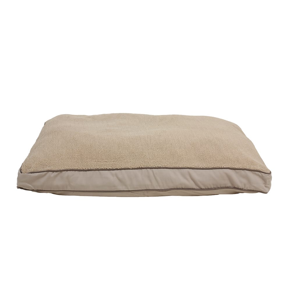 Beige dog bed with berber cover on a white background