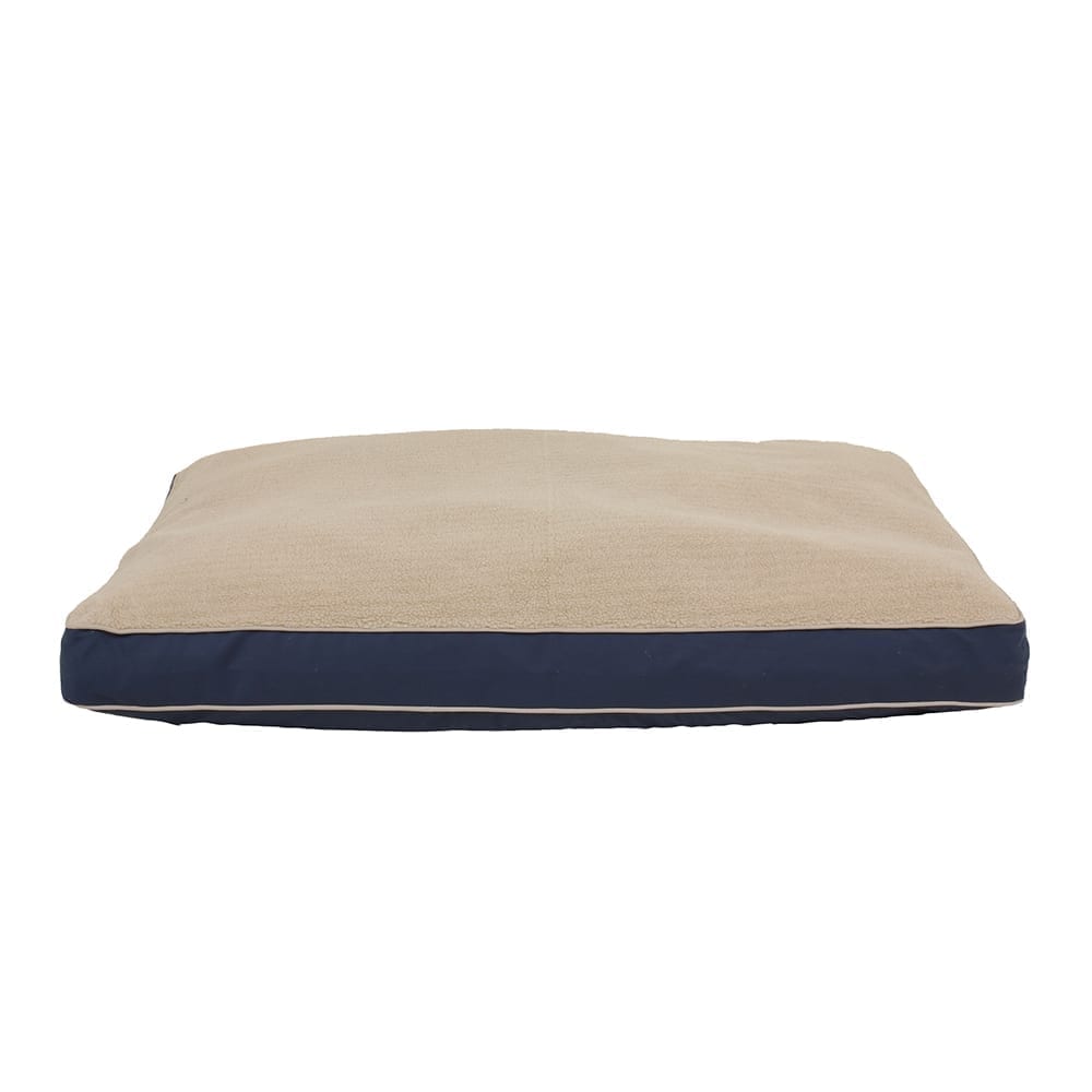 Beige and navy pet bed on a white background
