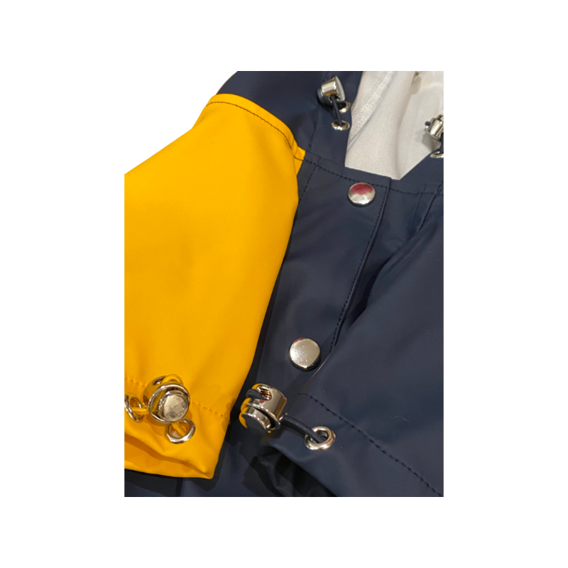 Close-up of a navy and yellow dog jacket for rain