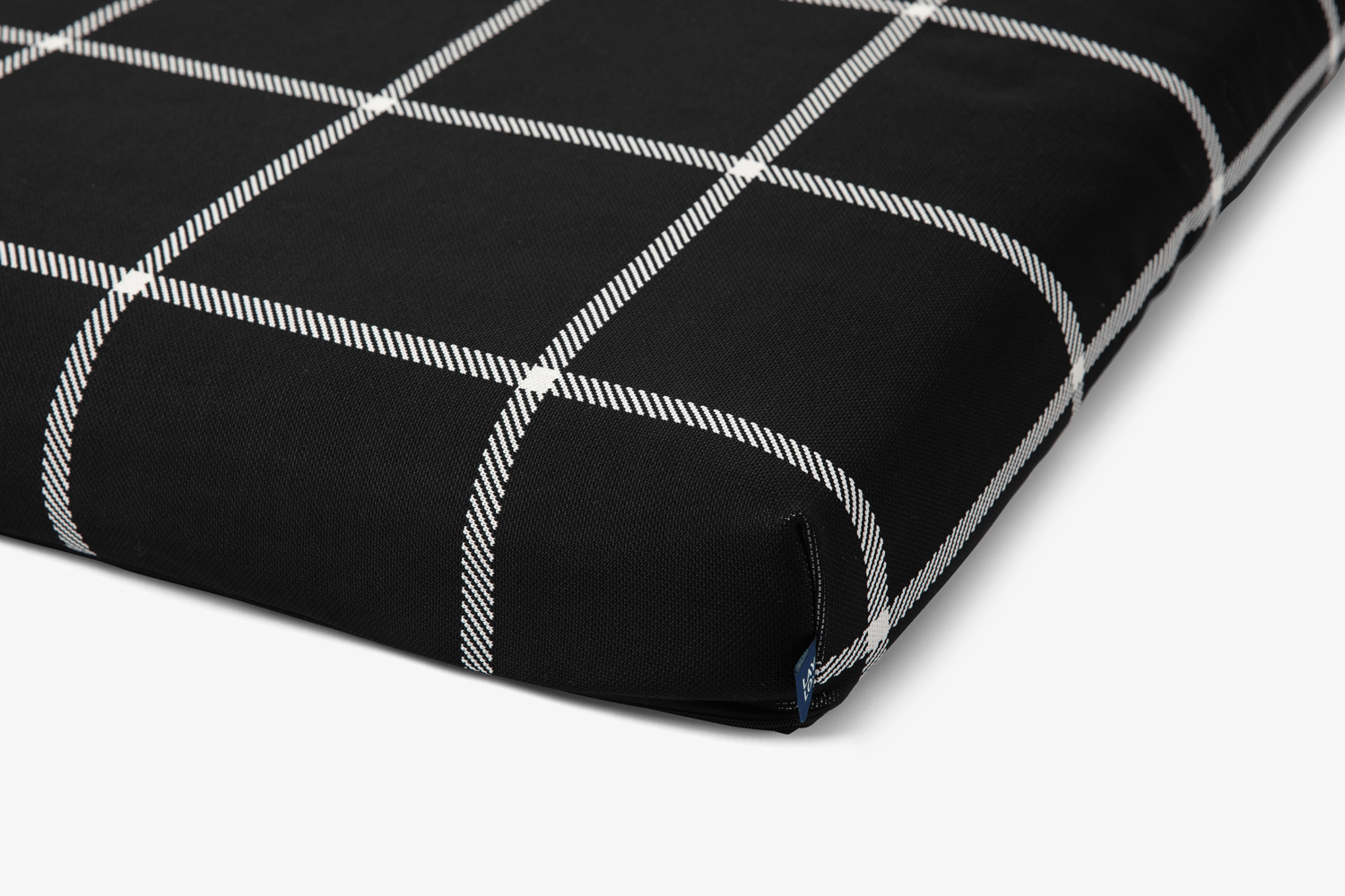 Black fabric for a dog bed with white grid pattern 