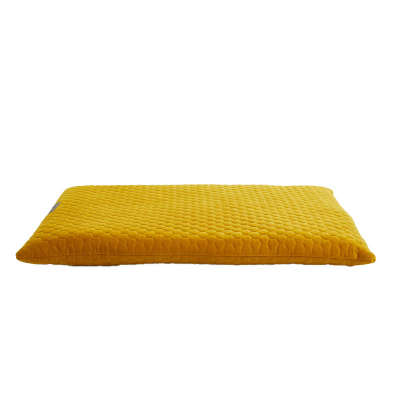 Yellow textured pet dog cushion on a white background