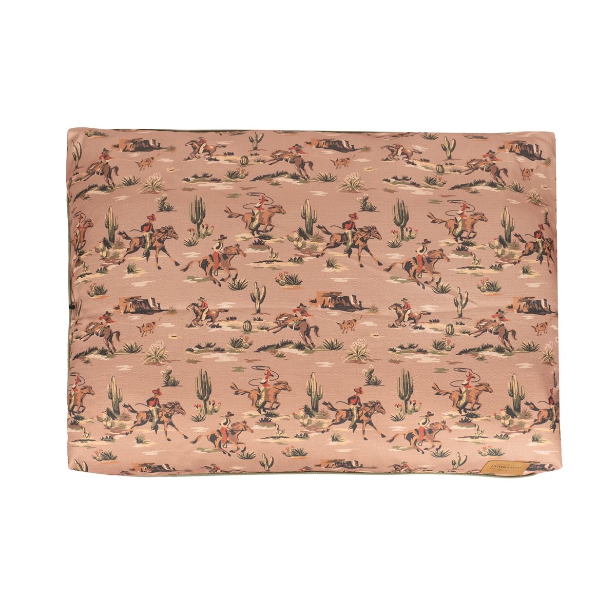 Rectangular dog pillow bed by Pendleton with cowboy pattern on a pink background