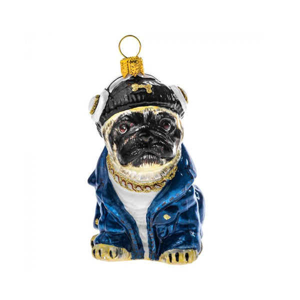 Glass ornament of a pug wearing a blue jacket and gold accessories on a white background