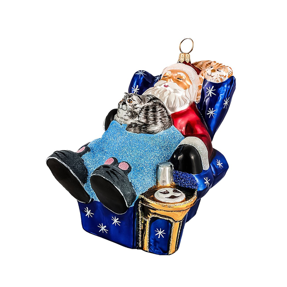 Decorative ornament of Santa Claus with a cat in a sleigh on a white background