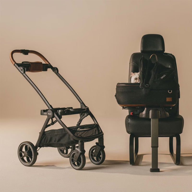 Black Tavo luxury pet stroller and car seat with a cat inside on a beige background
