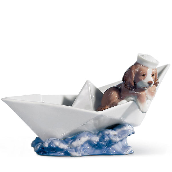 Lladro puppy figurine on a porcelain boat