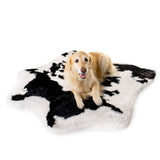 large dog golden retriever on cowhide orthopedic rug bed