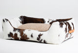 Luxury cowhide dog bed in farmhouse design style