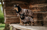 large dog and small dog wearing Paikka winter dog coats in leopard design.